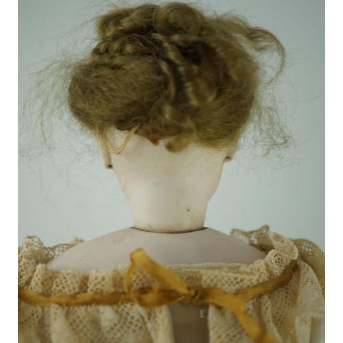 14 - An S.G. bisque shoulder head French fashion doll c.1875, cork pate mohair wig attached, swivel neck,... 