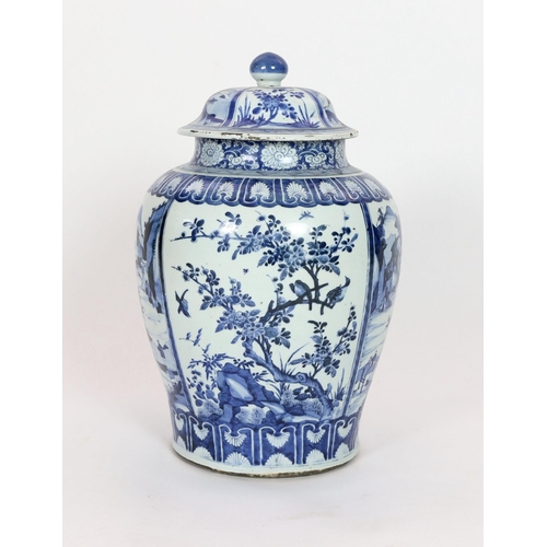 158 - A large Chinese blue and white jar and cover, Kangxi period, painted with alternating landscape pane... 