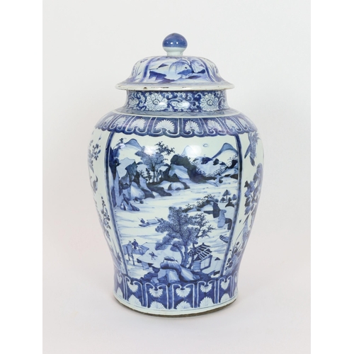 158 - A large Chinese blue and white jar and cover, Kangxi period, painted with alternating landscape pane... 