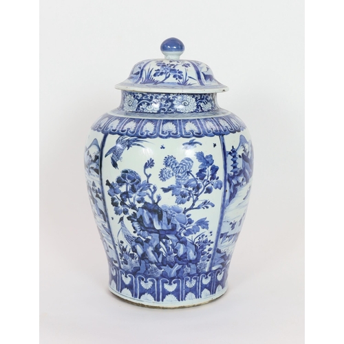 158 - A large Chinese blue and white jar and cover, Kangxi period, painted with alternating landscape pane... 