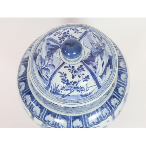 158 - A large Chinese blue and white jar and cover, Kangxi period, painted with alternating landscape pane... 