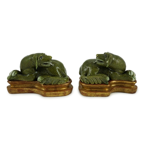 171 - A pair of Chinese green glazed models of hounds, 19th century, each with open mouth and protruding t... 