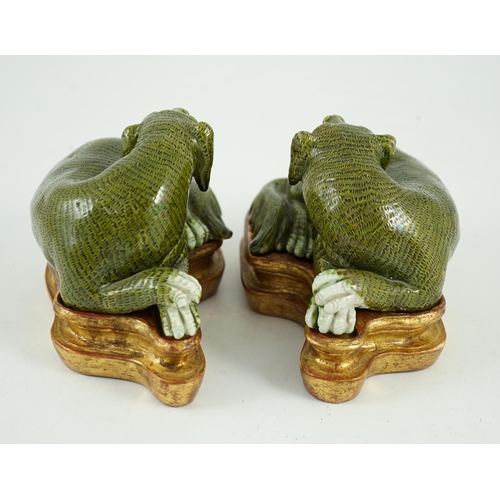 171 - A pair of Chinese green glazed models of hounds, 19th century, each with open mouth and protruding t... 