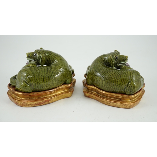 171 - A pair of Chinese green glazed models of hounds, 19th century, each with open mouth and protruding t... 