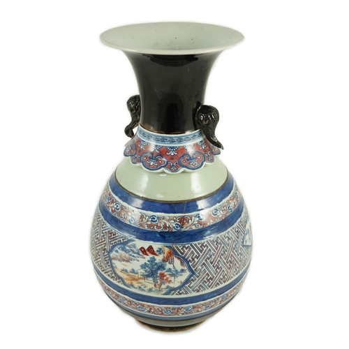 175 - A Chinese underglaze blue and copper red vase, Xuande mark, 19th century, the brown glazed neck appl... 