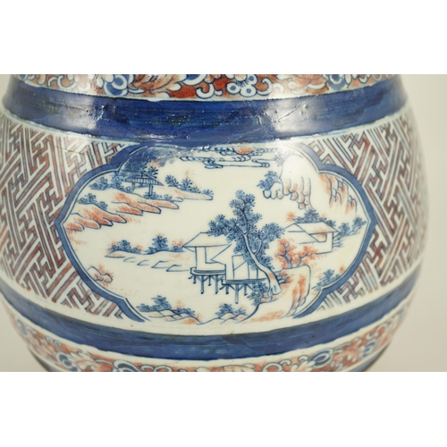 175 - A Chinese underglaze blue and copper red vase, Xuande mark, 19th century, the brown glazed neck appl... 