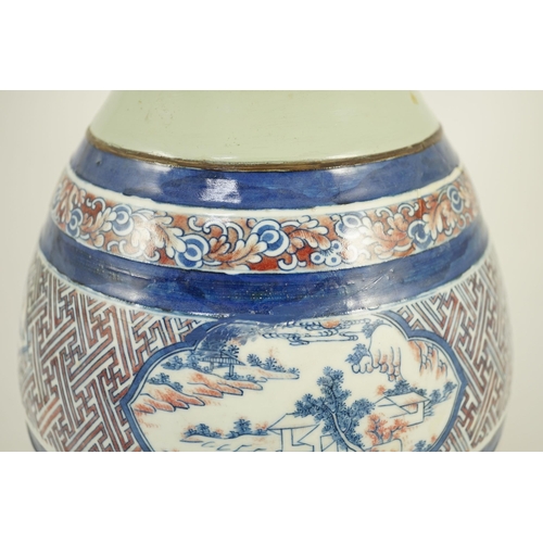 175 - A Chinese underglaze blue and copper red vase, Xuande mark, 19th century, the brown glazed neck appl... 