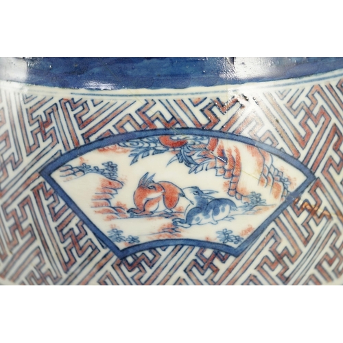 175 - A Chinese underglaze blue and copper red vase, Xuande mark, 19th century, the brown glazed neck appl... 