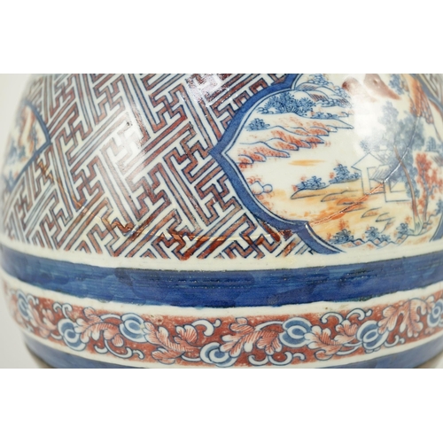 175 - A Chinese underglaze blue and copper red vase, Xuande mark, 19th century, the brown glazed neck appl... 