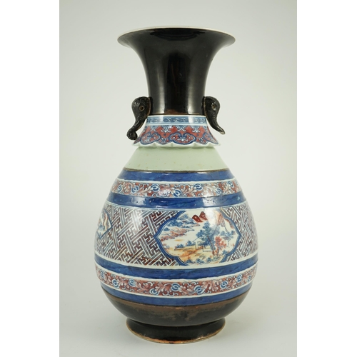 175 - A Chinese underglaze blue and copper red vase, Xuande mark, 19th century, the brown glazed neck appl... 