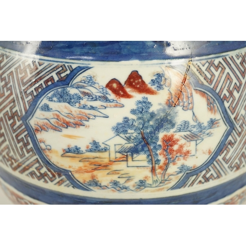 175 - A Chinese underglaze blue and copper red vase, Xuande mark, 19th century, the brown glazed neck appl... 