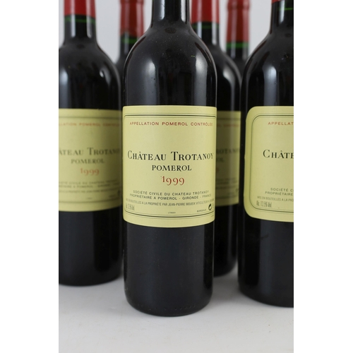 18 - Nine bottles of Chateau Trotanoy Pomerol 1999, height 30cm