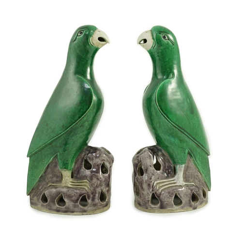 185 - A pair of Chinese green and aubergine glazed models of parrots, 19th century, each figure standing o... 