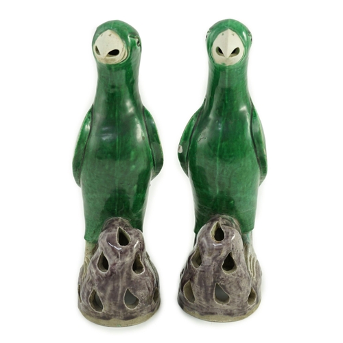 185 - A pair of Chinese green and aubergine glazed models of parrots, 19th century, each figure standing o... 