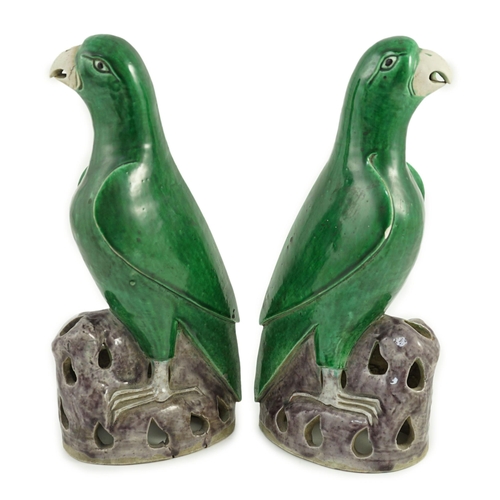 185 - A pair of Chinese green and aubergine glazed models of parrots, 19th century, each figure standing o... 