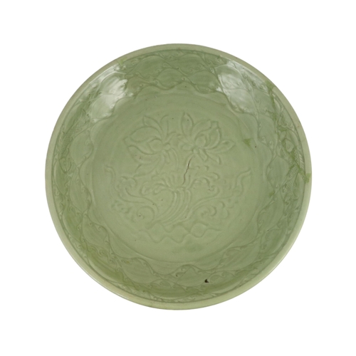 189 - A rare large Chinese Ming Longquan celadon dish, 14th century, the centre carved with lotus flowers,... 