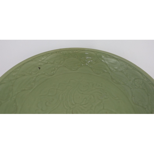 189 - A rare large Chinese Ming Longquan celadon dish, 14th century, the centre carved with lotus flowers,... 