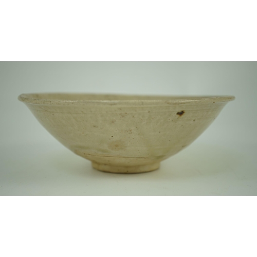 190 - A Chinese Ding ware bowl, Song dynasty, the interior moulded with chrysanthemum petals 16.5 cm diame... 