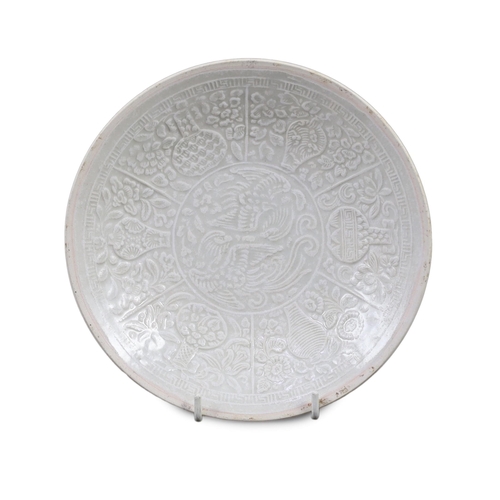 192 - A Chinese Qingbai Phoenix moulded dish, Yuan dynasty, the central medallion moulded with twin Phoe... 