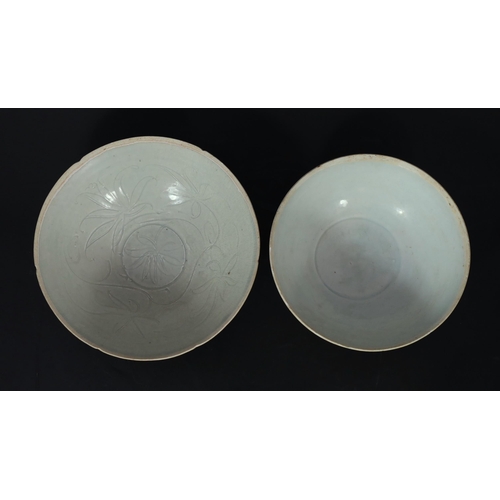 193 - Two Chinese Qingbai bowls, Song dynasty, the first with petal lobed rim, incised with flowers to the... 