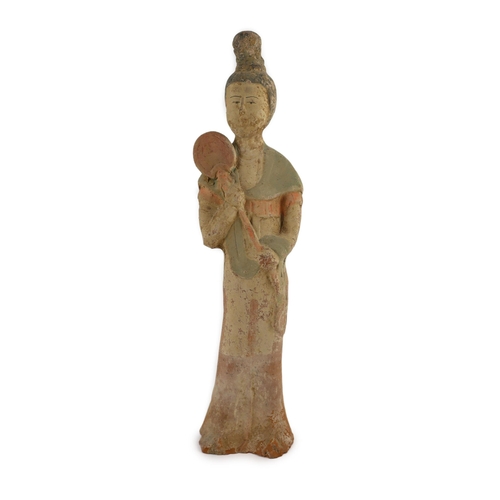 194 - A Chinese painted pottery figure of a courtier, Tang dynasty, holding a mirror or fan, 41.5cm high... 