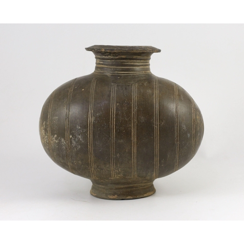 196 - A Chinese black pottery cocoon-shaped jar, Western Han dynasty, (206 B.C.A.D. 9) 25cm high