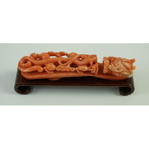 203 - A rare Chinese coral 'dragon' belt hook 18th/19th century, carved in high relief and open work with ... 