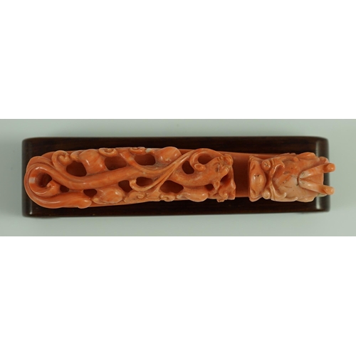 203 - A rare Chinese coral 'dragon' belt hook 18th/19th century, carved in high relief and open work with ... 