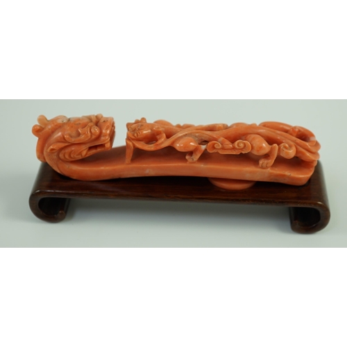 203 - A rare Chinese coral 'dragon' belt hook 18th/19th century, carved in high relief and open work with ... 