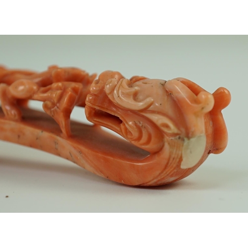 203 - A rare Chinese coral 'dragon' belt hook 18th/19th century, carved in high relief and open work with ... 