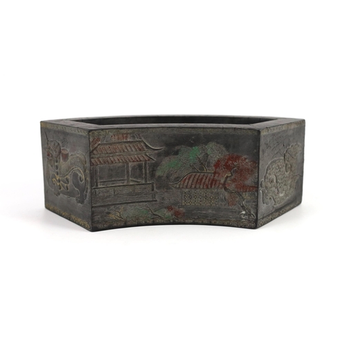 205 - A Chinese compressed ink block in the form of a flower pot, Ming mark, Qing dynasty, moulded in reli... 