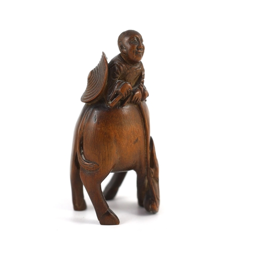 208 - A Chinese bamboo group of boy riding a buffalo, 18th/19th century, of caramel brown patina, 12.5 cm ... 