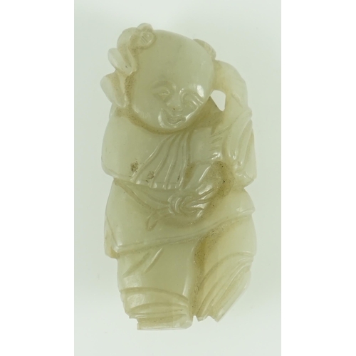 217 - A Chinese celadon jade figure of a boy holding a lotus sprig, 19th century 5.2 cm high