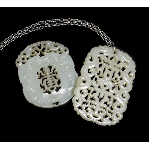 226 - Two Chinese pale celadon jade openwork plaques, 19th century, each pierced with the character shou... 