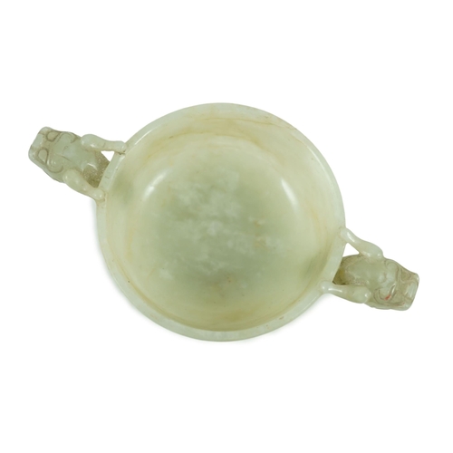 231 - A Chinese pale celadon jade two handled chilong cup, 17th/18th century, with a pair of carved drag... 