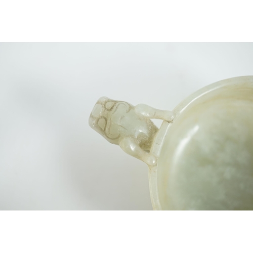 231 - A Chinese pale celadon jade two handled chilong cup, 17th/18th century, with a pair of carved drag... 