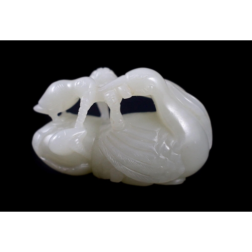 238 - A Chinese pale celadon jade duck group, carved as a duck and chick on an egg eating millet, 5.5 cm l... 