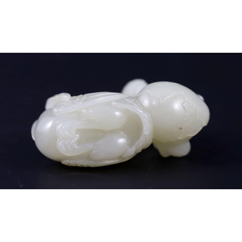 238 - A Chinese pale celadon jade duck group, carved as a duck and chick on an egg eating millet, 5.5 cm l... 