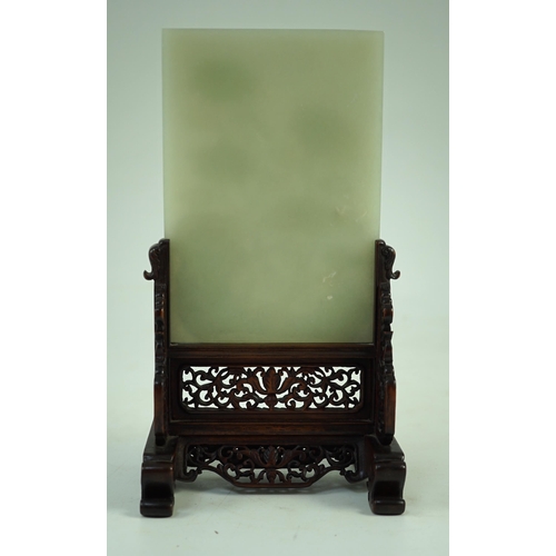 241 - A good Chinese celadon jade peonies and rockwork small table screen and stand, 18th/19th century, ... 