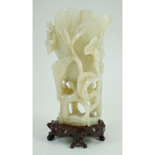 243 - A large Chinese pale celadon jade magnolia cup, 17th/18th century carved in high relief and openwo... 