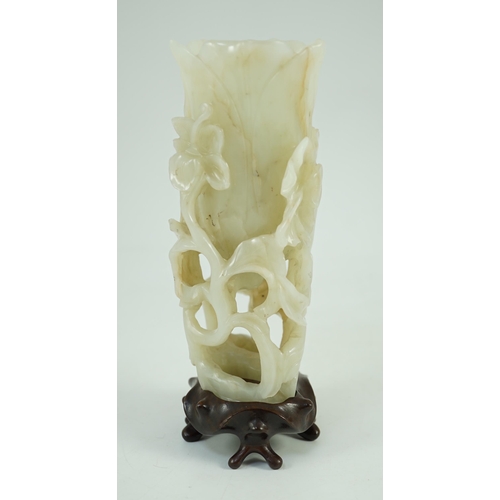 243 - A large Chinese pale celadon jade magnolia cup, 17th/18th century carved in high relief and openwo... 