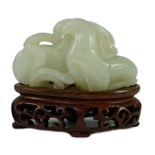 244 - A Chinese pale celadon jade Lotus pebble carving, 18th/19th century, the stone of good even tone w... 