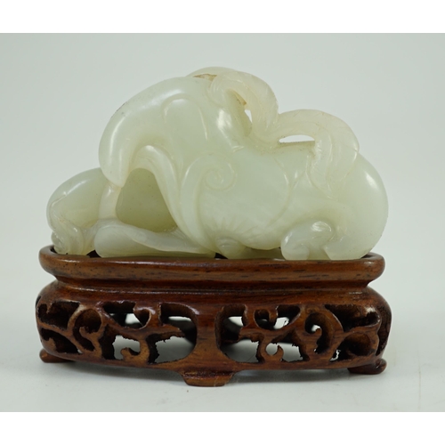 244 - A Chinese pale celadon jade Lotus pebble carving, 18th/19th century, the stone of good even tone w... 