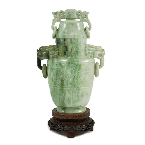 246 - A Chinese archaistic jadeite two-handled vase and cover, first half 20th century, of flattened balus... 