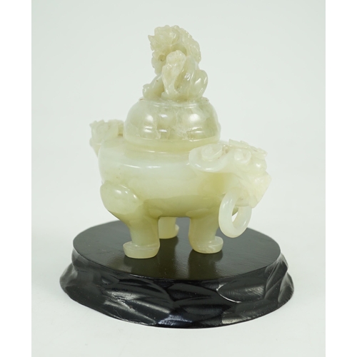 249 - A Chinese pale celadon jade tripod censer cover, 20th century, 12cm wide, wood stand