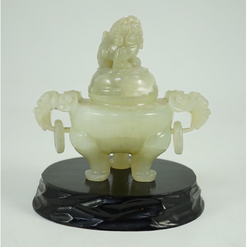 249 - A Chinese pale celadon jade tripod censer cover, 20th century, 12cm wide, wood stand