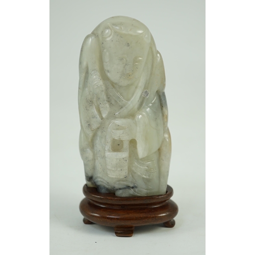 250 - A Chinese white, grey and russet jade figure of Zhou Yanzi, Ming dynasty, the crouching figure holdi... 