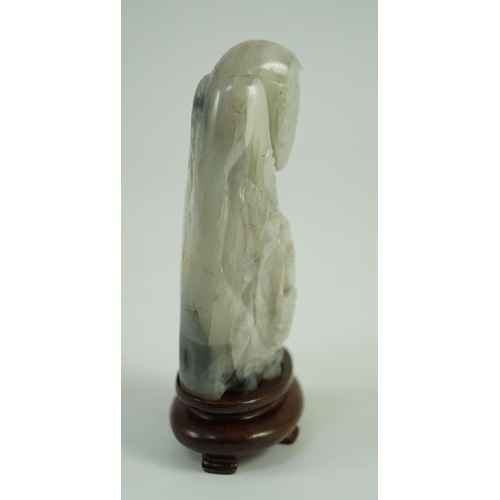 250 - A Chinese white, grey and russet jade figure of Zhou Yanzi, Ming dynasty, the crouching figure holdi... 