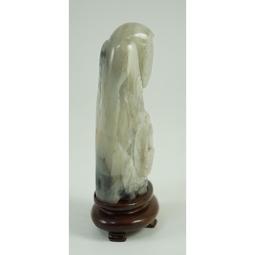 250 - A Chinese white, grey and russet jade figure of Zhou Yanzi, Ming dynasty, the crouching figure holdi... 