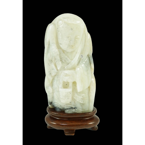 250 - A Chinese white, grey and russet jade figure of Zhou Yanzi, Ming dynasty, the crouching figure holdi... 